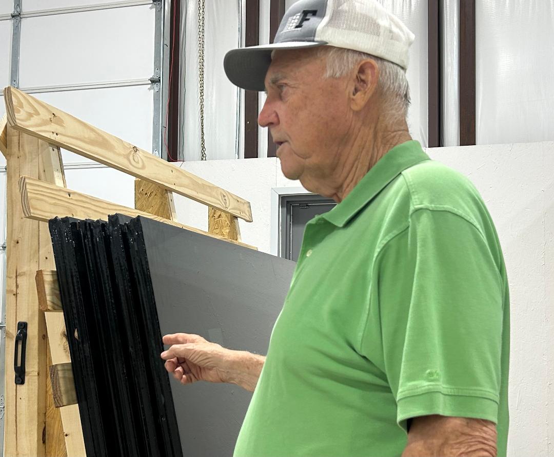 Founder Gary Shepard explaining the process of making frames and cutting windows to the  size needed
